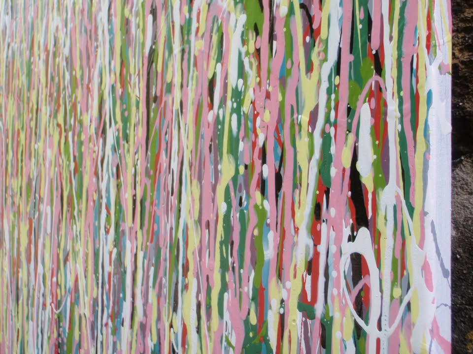 Abstract art with multicoloured vertical brush strokes on a white background - detail