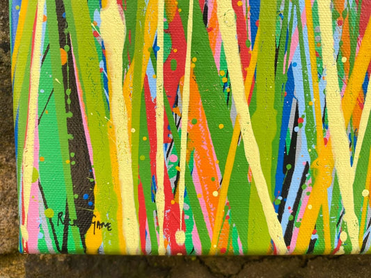 Colourful abstract painting of flowers and grass with a blue sky background, on a 100 by 70 cm canvas - detail