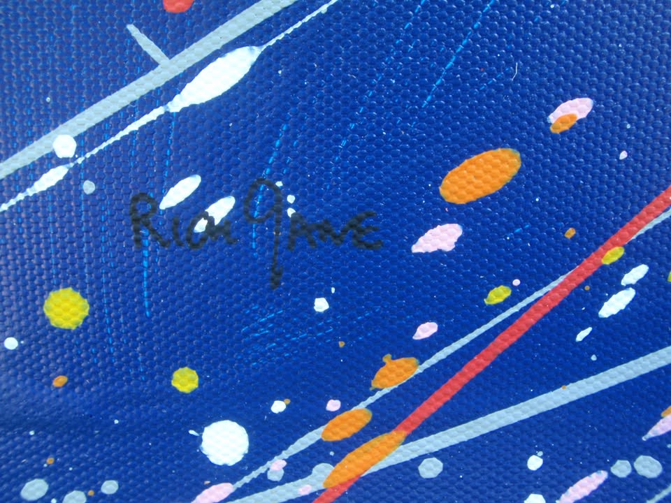 Modern art painting showing a burst of colourful rays of light from a central star against a dark blue sky - detail