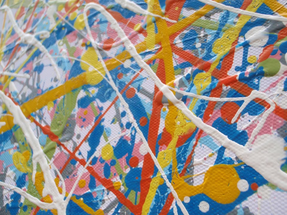 An abstract rectangular canvas painting filled with dense, energetic lines and dots in a multicolour palette of yellow, blue, orange, and white on a light background. Hand-painted on to a 250 by 112 cm canvas. Detail.