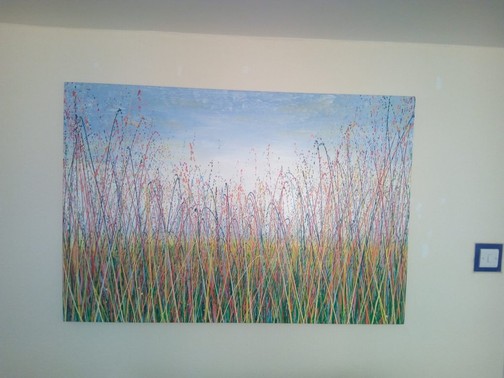 Customer showcase photo of my large original landscape painting on display in his home - close up