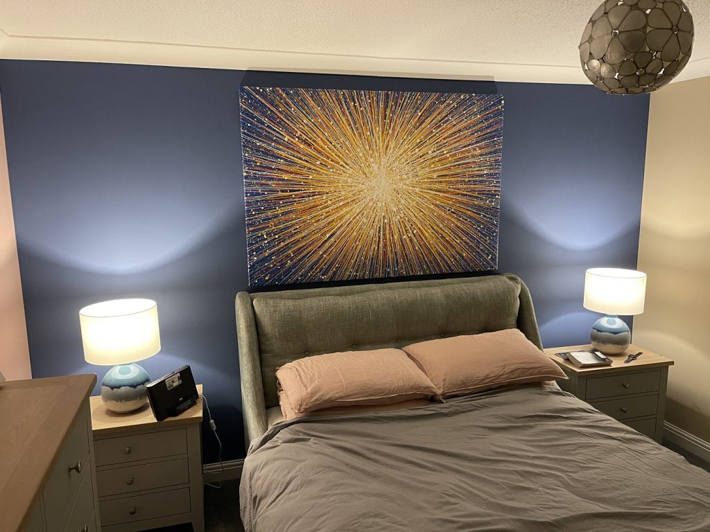 Customer photo showing my hand painted original yellow star painting on a large canvas, on display in his home