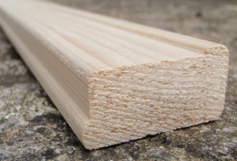 Angled view of a standard wooden stretcher bar showing its profile
