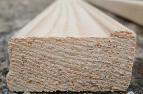 Cross sectional view of wooden canvas stretcher bar showing raised lips to support the canvas fabric