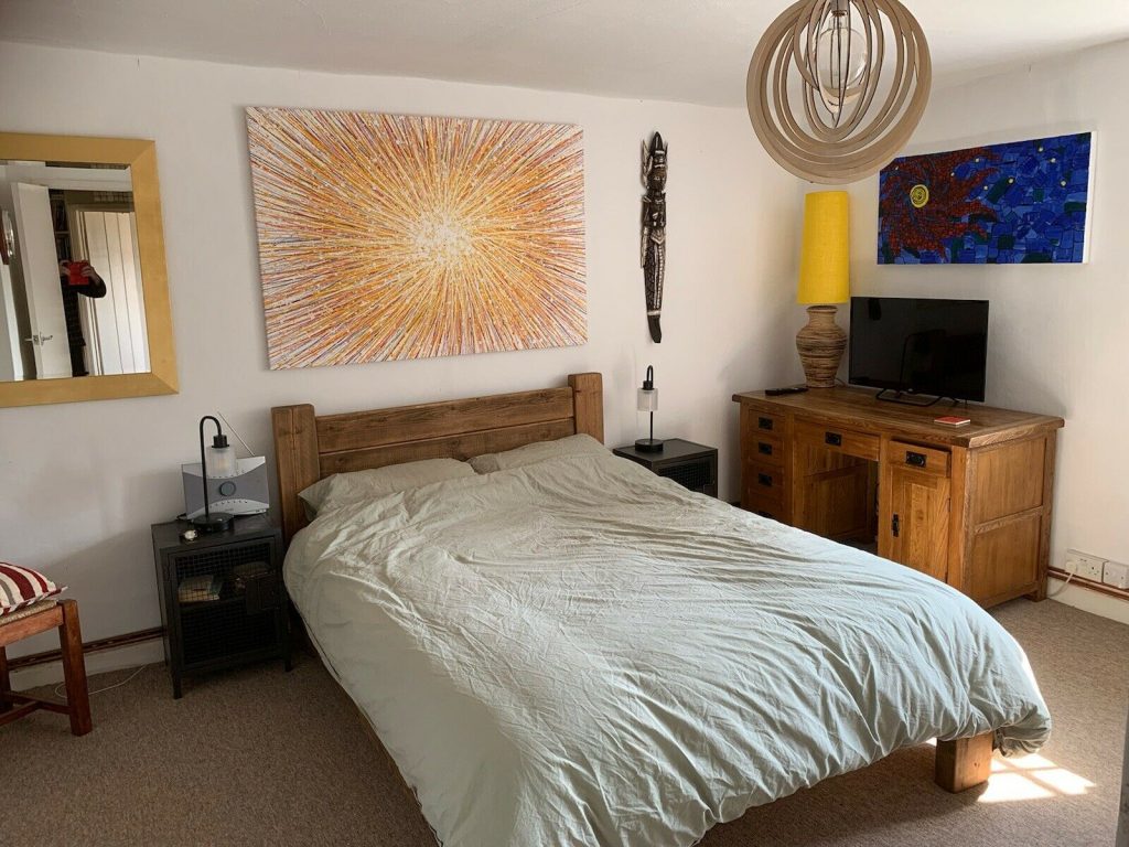 Customer showcase photo of my yellow starburst original oversize canvas painting