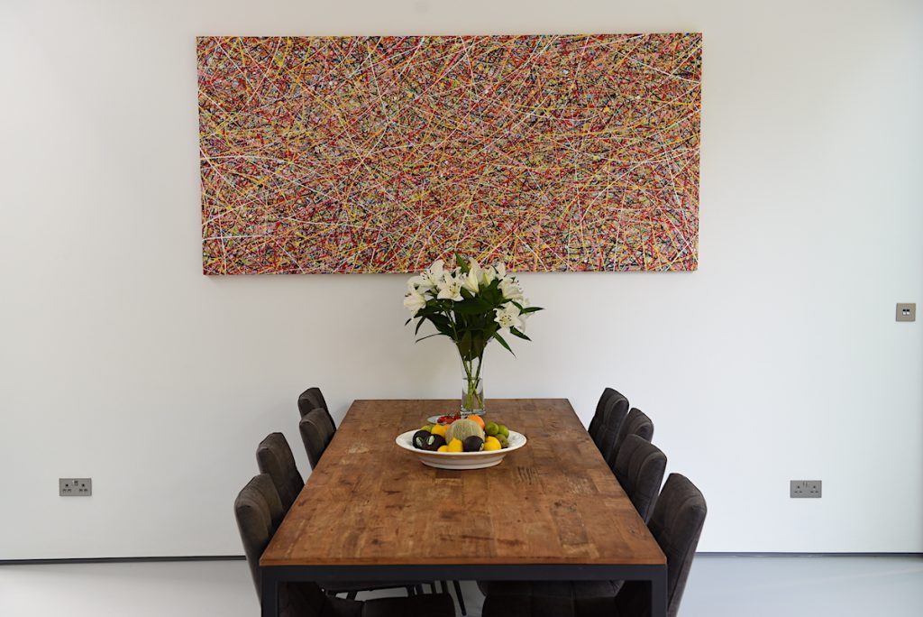 Really wide abstract drip painting in vibrant colours by Rich Gane