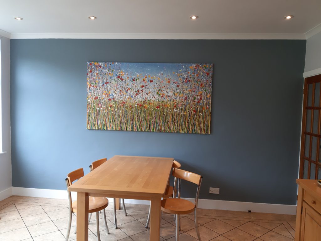 Customer showcase photo of my really big abstract flower painting on a landscape canvas