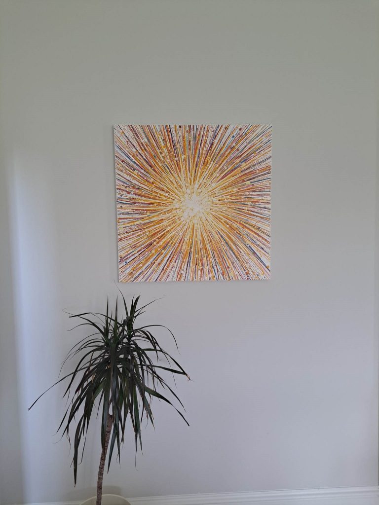 Customer showcase photo of my yellow starburst original canvas painting on display in her home