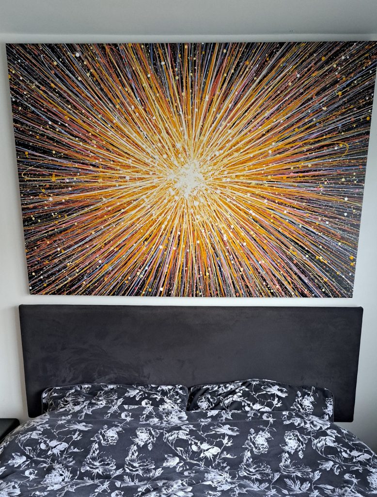 160 cm by 112 cm original yellow star painting on a black background, on display in my customer's home