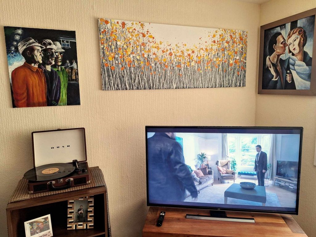 Customer showcase photo of my black, white and orange abstract flower meadow painting