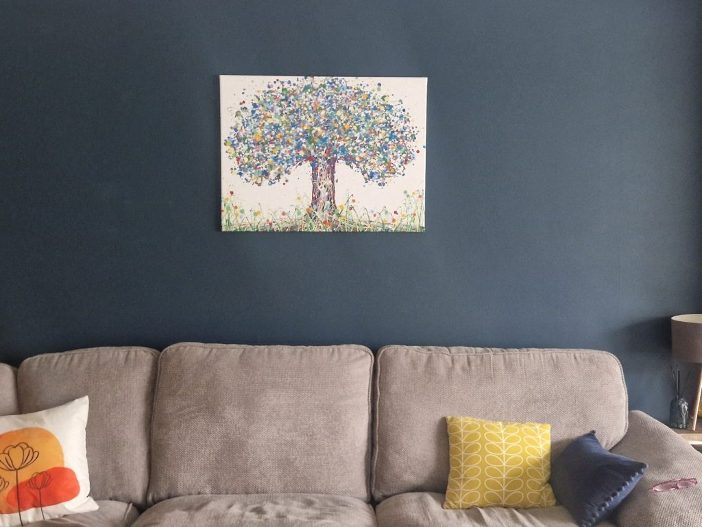 80 cm by 60 cm colourful abstract blue tree painting on canvas by Rich Gane, on display in my customer's home