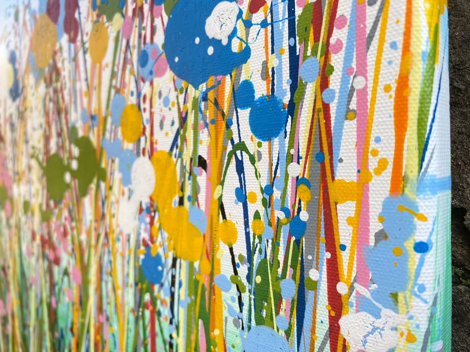Colourful abstract painting of flowers and grass with a blue sky background, on a 100 by 70 cm canvas - detail