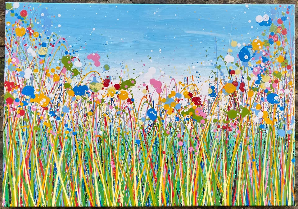 Colourful abstract painting of flowers and grass with a blue sky background, on a 100 by 70 cm canvas - full view