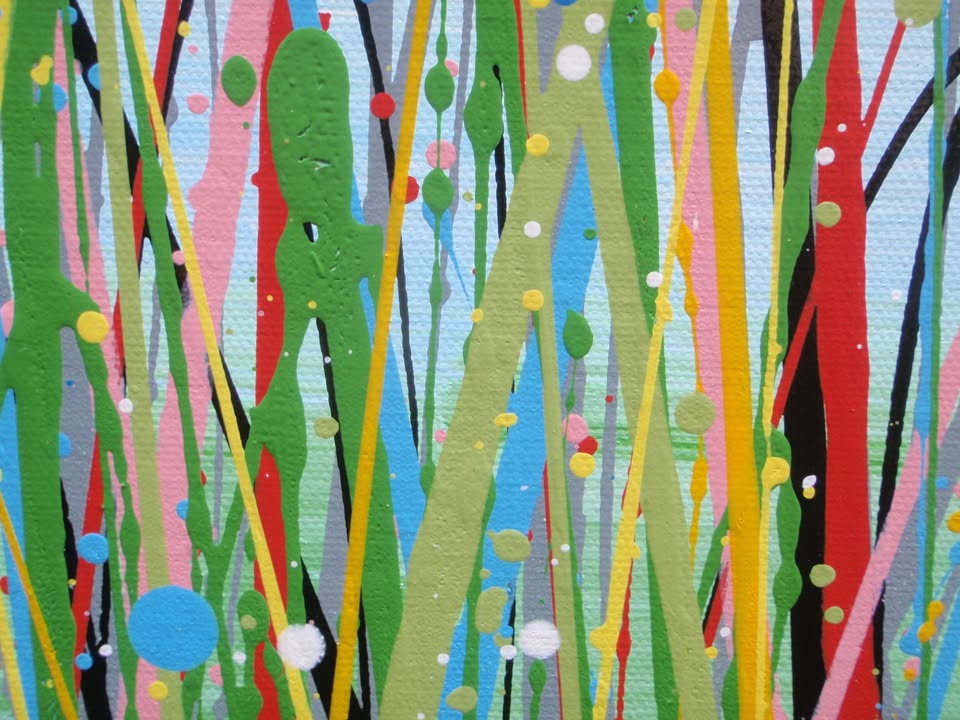 A colourful abstract painting of a grassy field with tall green, yellow, and red strokes, dotted with red, blue, orange, and pink flowers, beneath a light blue sky with white paint splatter. Hand-painted on to a large 100 by 70 cm canvas - detail