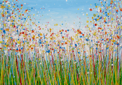 A colourful abstract painting of a grassy field with tall green, yellow, and red strokes, dotted with red, blue, orange, and pink flowers, beneath a light blue sky with white paint splatter. Hand-painted on to a large 100 by 70 cm canvas - full view