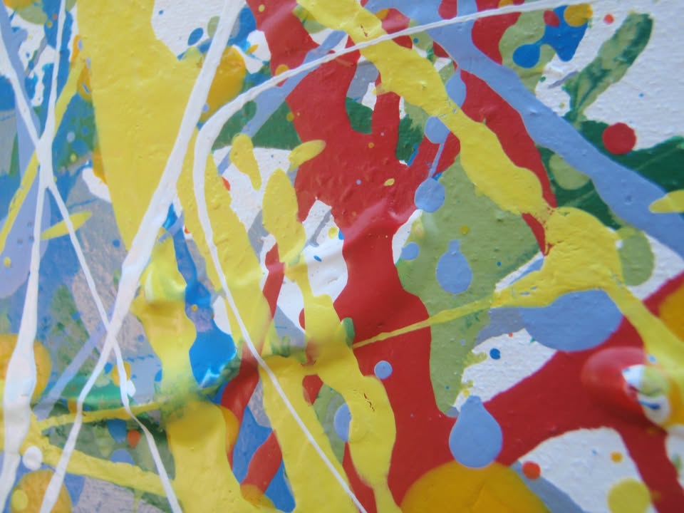 Abstract art with colourful drips and splashes of red, yellow, and blue, on a large framed canvas - detail