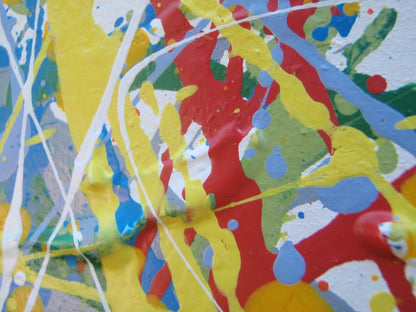 Abstract art with colourful drips and splashes of red, yellow, and blue, on a large framed canvas - detail