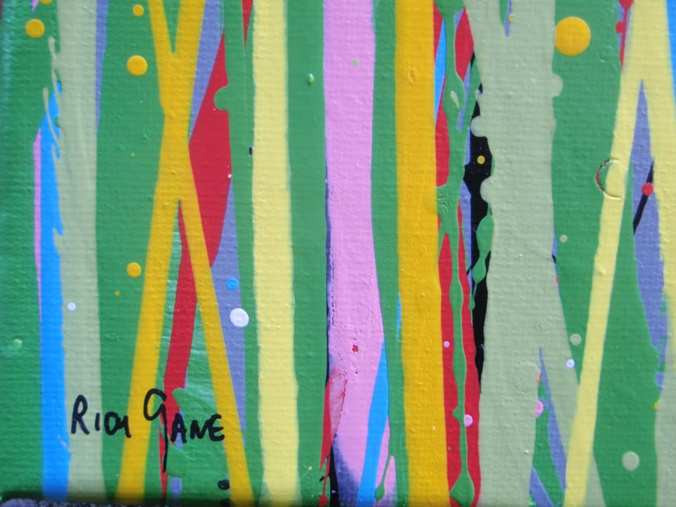 A colourful abstract landscape painting depicting a field of tall grass under a blue sky, with splatters and drips of yellow, red, orange, blue, pink, and green paint throughout. Hand-painted on to a large 101.5 by 81 cm stretched canvas - detail