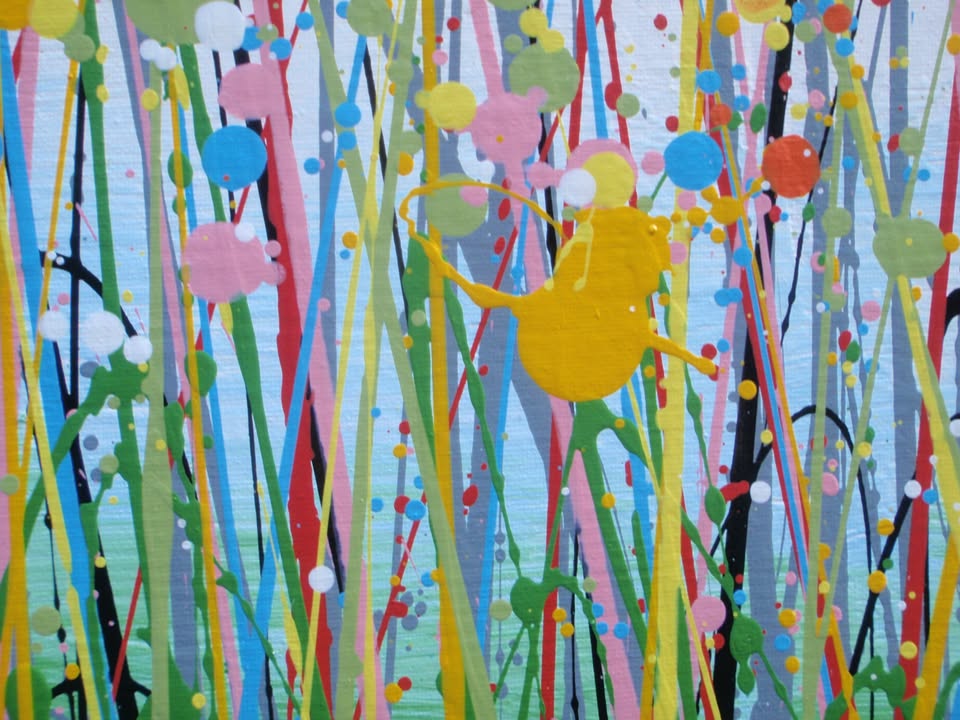 A colourful abstract landscape painting depicting a field of tall grass under a blue sky, with splatters and drips of yellow, red, orange, blue, pink, and green paint throughout. Hand-painted on to a large 101.5 by 81 cm stretched canvas - detail