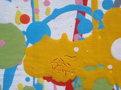 A colourful abstract landscape painting depicting a field of tall grass under a blue sky, with splatters and drips of yellow, red, orange, blue, pink, and green paint throughout. Hand-painted on to a large 101.5 by 81 cm stretched canvas - detail
