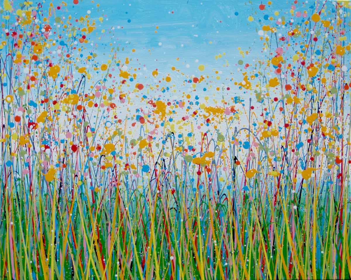 A colourful abstract landscape painting depicting a field of tall grass under a blue sky, with splatters and drips of yellow, red, orange, blue, pink, and green paint throughout. Hand-painted on to a large 101.5 by 81 cm stretched canvas - full view
