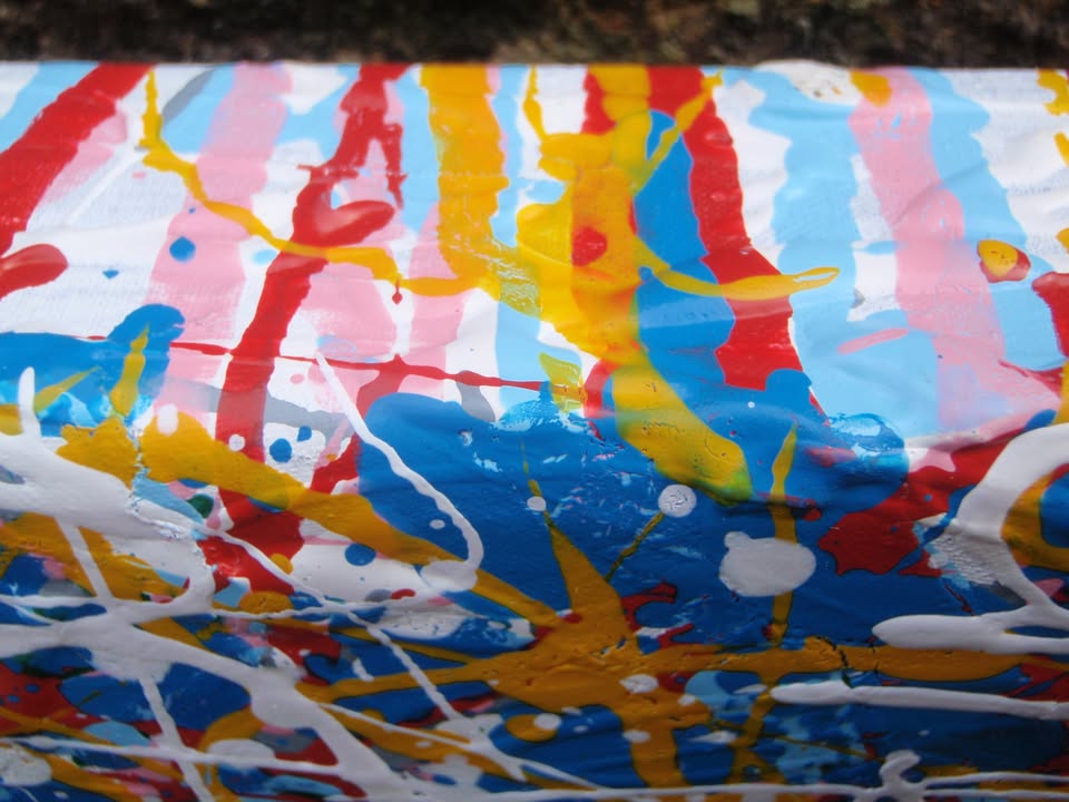 Abstract artwork with a mix of blue, red, and yellow colours on a textured background, on a stretched 120 by 120.5 cm canvas - detail