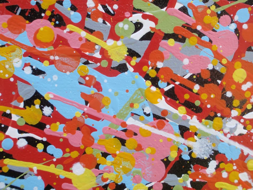Really big hand painted colourful abstract painting on a very large framed canvas, featuring a vibrant starburst on a black background - detail