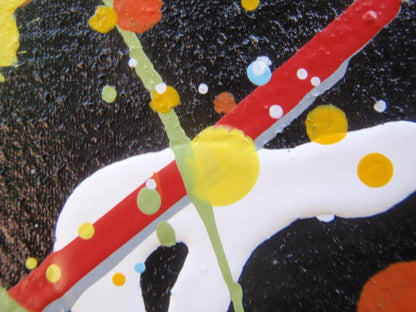 Really big hand painted colourful abstract painting on a very large framed canvas, featuring a vibrant starburst on a black background - detail