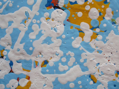 Unique abstract radial artwork filled with dense splatters and streaks of blue, red, orange, yellow, black, and white radiating from a bright white centre, on a 150 by 100 cm framed canvas - detail