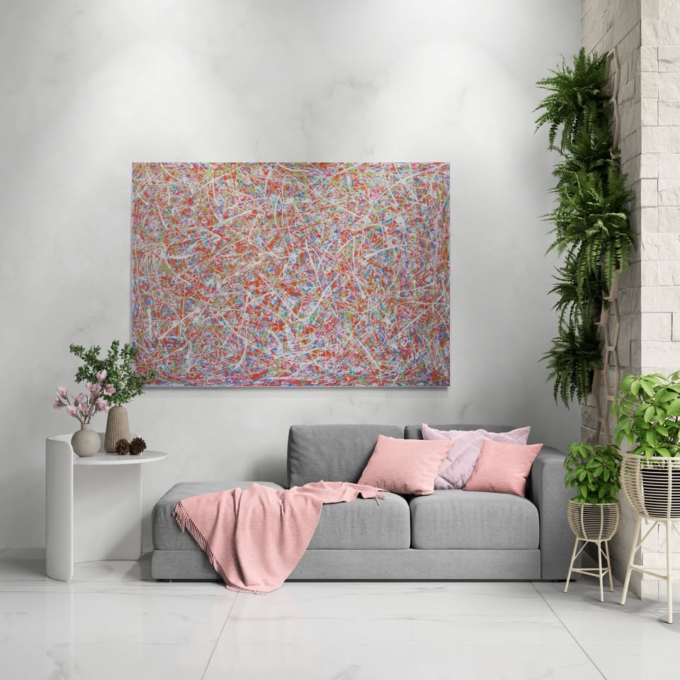 158 by 112 cm hand-painted abstract canvas with orange, green and white drips and splashes - shown on display in a large room