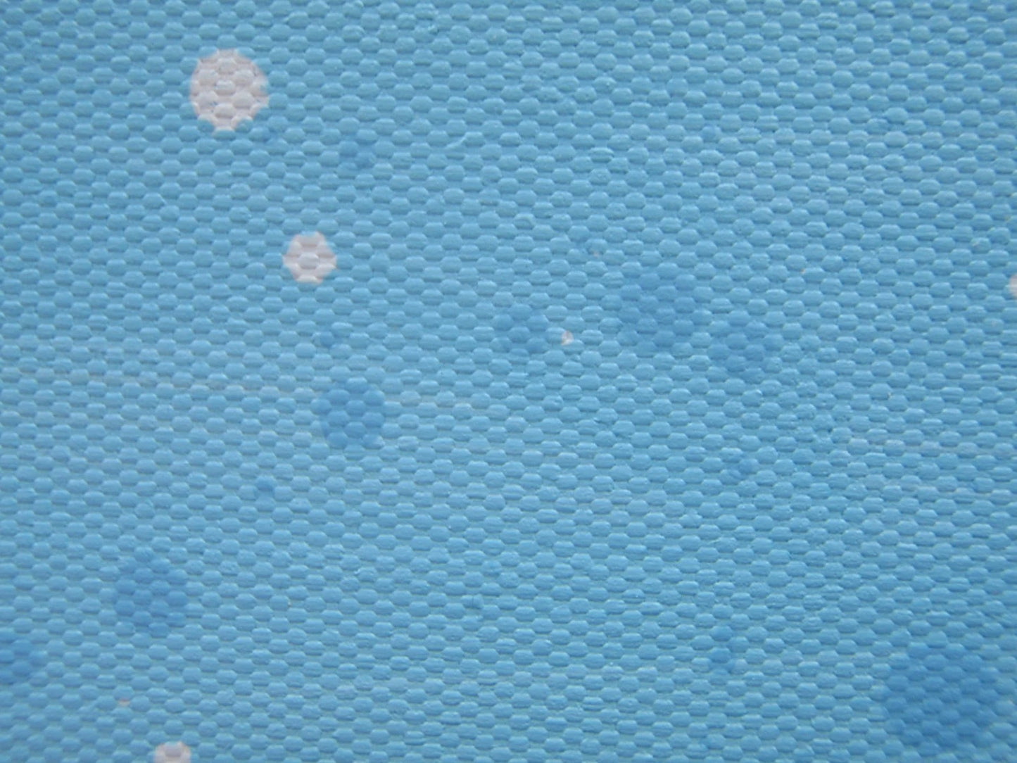 Colourful abstract painting of blue flowers and grass with a blue sky, on a 159 cm by 112 cm canvas - detail