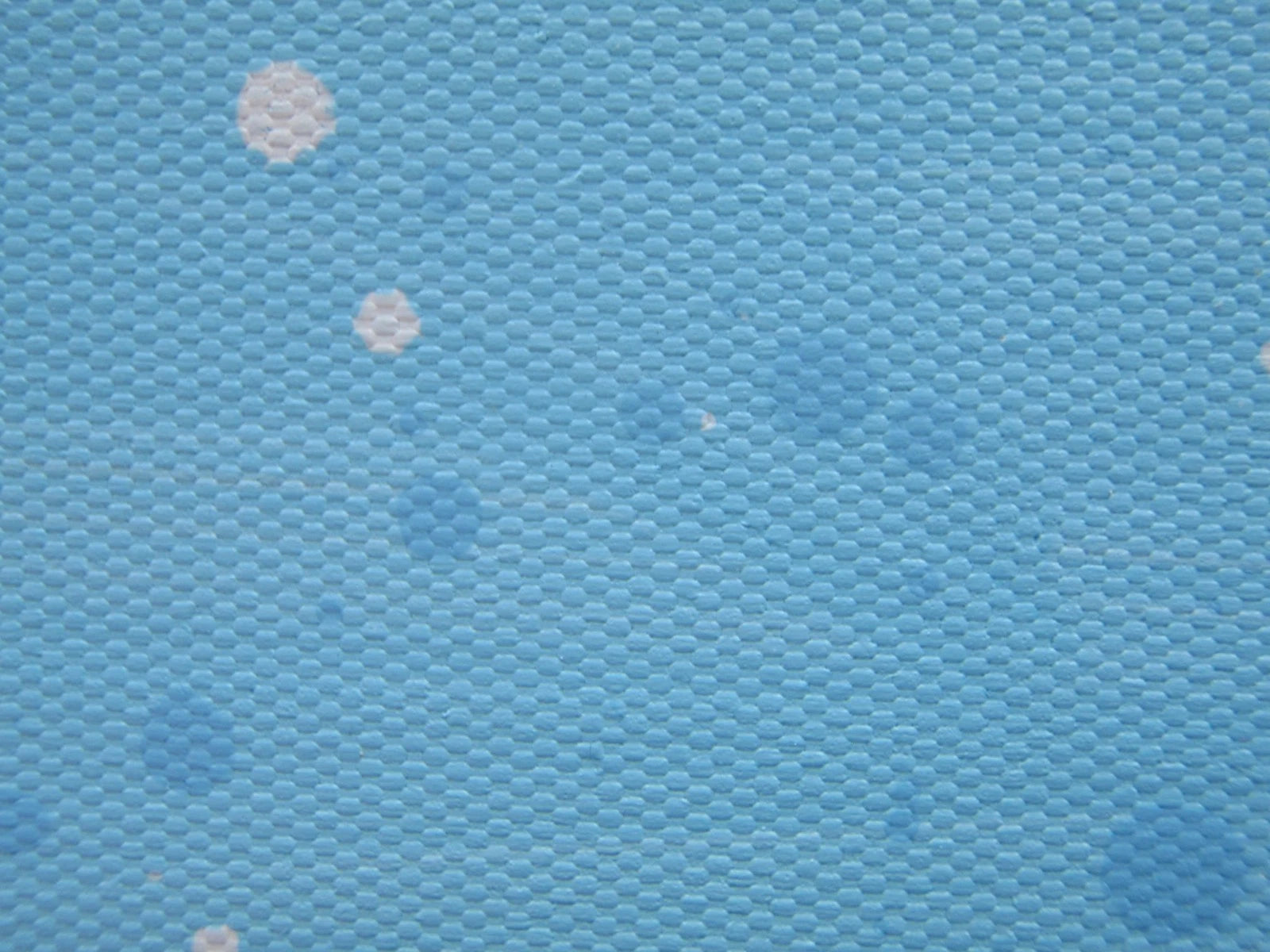 Colourful abstract painting of blue flowers and grass with a blue sky, on a 159 cm by 112 cm canvas - detail