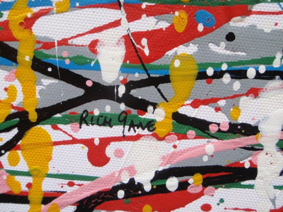 Abstract artwork of a face with colourful drips and splashes on a white background, painted on to an un-stretched 159 by 112 cm canvas - detail