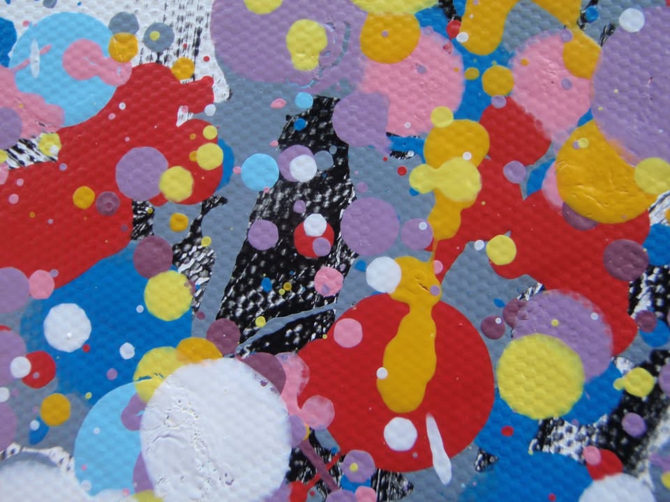 A colourful abstract painting of a tree with a dense canopy made of multicoloured paint splatters, including lilac and purple, and a textured trunk, set against a plain white background. Hand painted on to a 159 by 112 cm canvas. Close up photo.