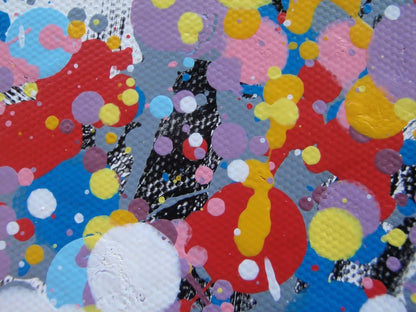 A colourful abstract painting of a tree with a dense canopy made of multicoloured paint splatters, including lilac and purple, and a textured trunk, set against a plain white background. Hand painted on to a 159 by 112 cm canvas. Close up photo.