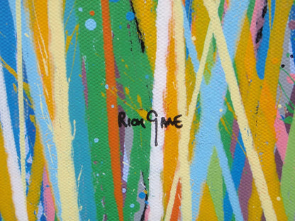 Colourful abstract art with a signature in the centre - detail