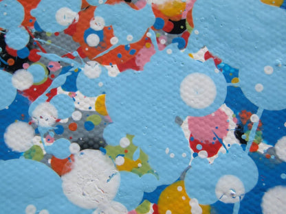 A rectangular abstract art painting featuring a dense seascape of multicoloured speckles, with a prominent horizontal band of white and light blue in the centre and denser blue speckling around the edges. Hand-painted on to a 250 by 112 cm un-stretched canvas. Detail.