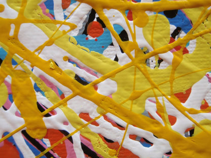 Abstract expressionist painting featuring a dense, circular composition of energetic splatters, drips, and intersecting lines in yellow, white, red, blue, black, and orange. Hand-painted by me, Rich Gane, on to a large, framed, 80 by 60 cm canvas - detail