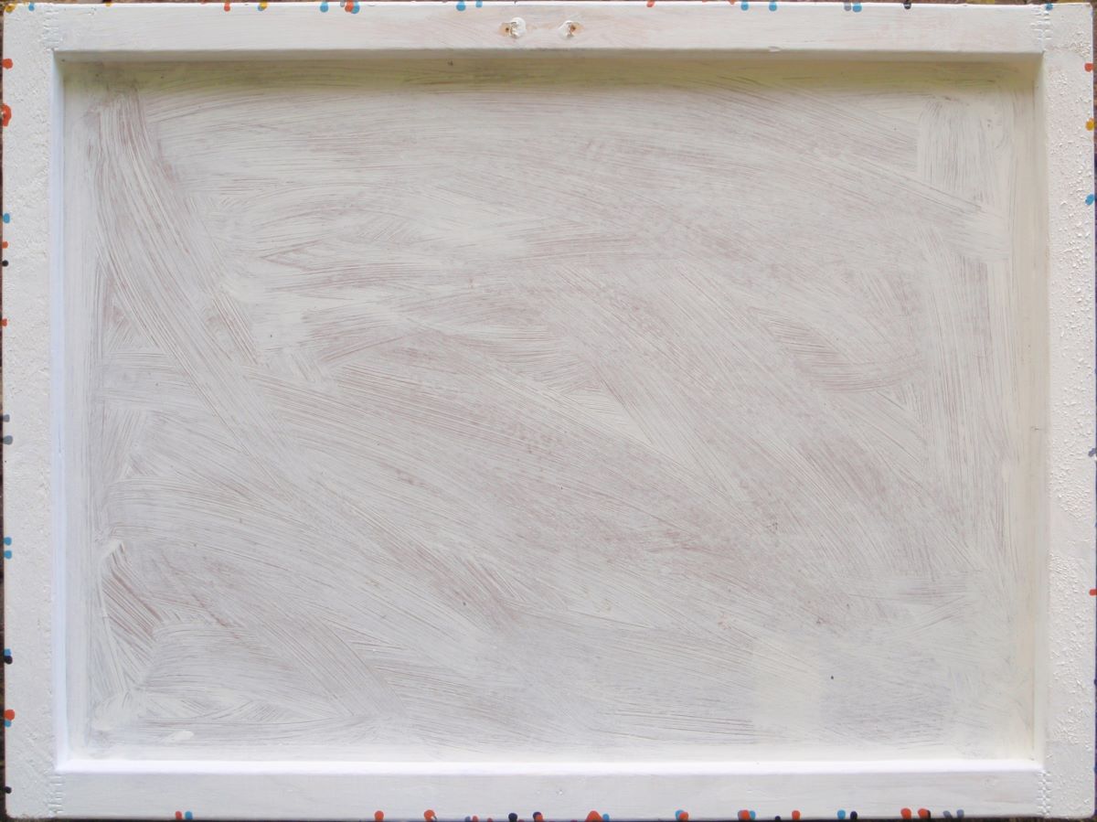 An abstract painting filled with dense, energetic splatters and drips in orange, yellow, white, black, and light blue, hand-painted on to a large framed wooden panel - back