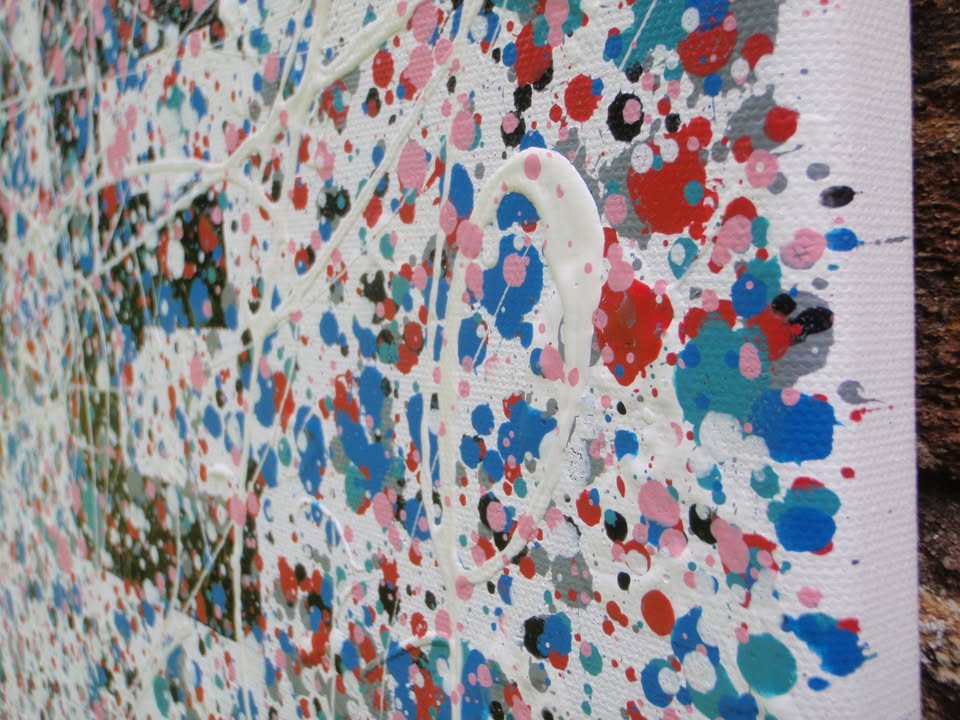 Colourful mosaic artwork with 'LOVE' spelled out on a textured background - detail