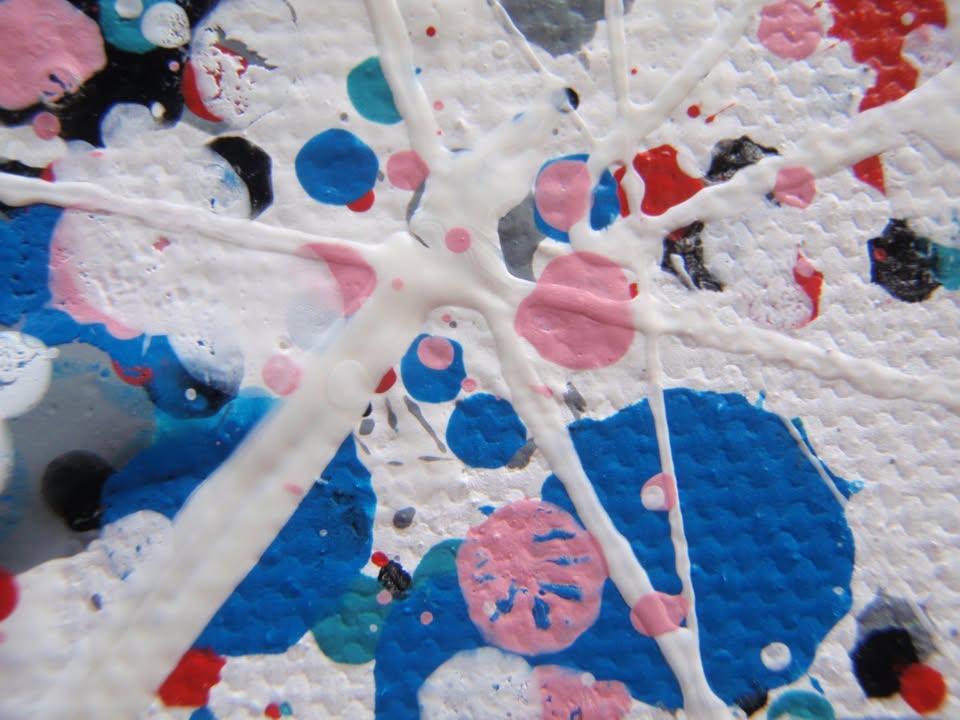 Colourful mosaic artwork with 'LOVE' spelled out on a textured background - detail