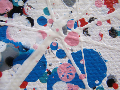 Colourful mosaic artwork with 'LOVE' spelled out on a textured background - detail