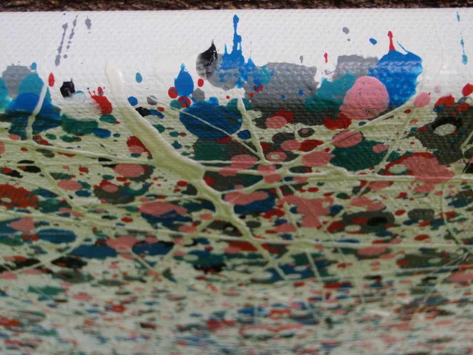 Colourful mosaic artwork with 'LOVE' spelled out on a textured background - detail