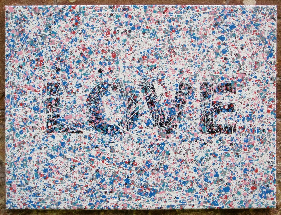 Colourful mosaic artwork with 'LOVE' spelled out on a textured background