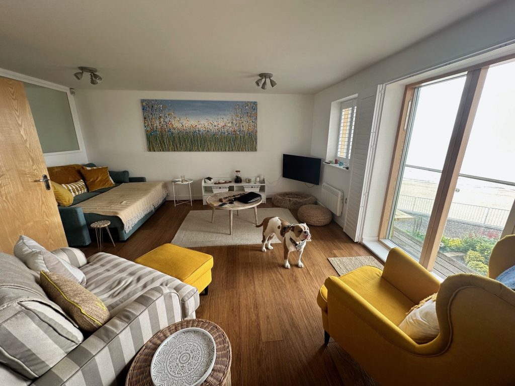 Customer showcase photo of my massive flower meadow painting on display in her property - distant view